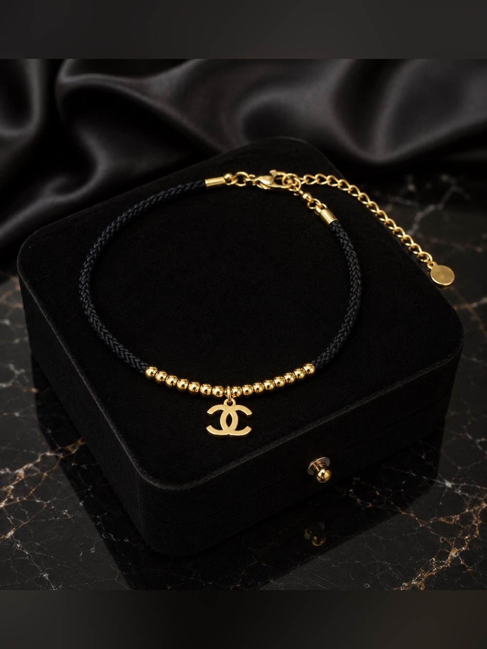 Iconic CC Monogram Gold Bead Black Cord Bracelet